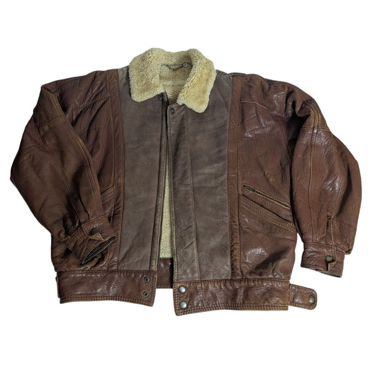 Veste Bombardier vintage en cuir marron doublée de peau lainée avec intérieur matelassé et fermetures à pression, taille L